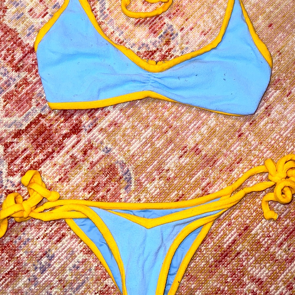 Frankie’s bikini set top is size small and bottoms are XS